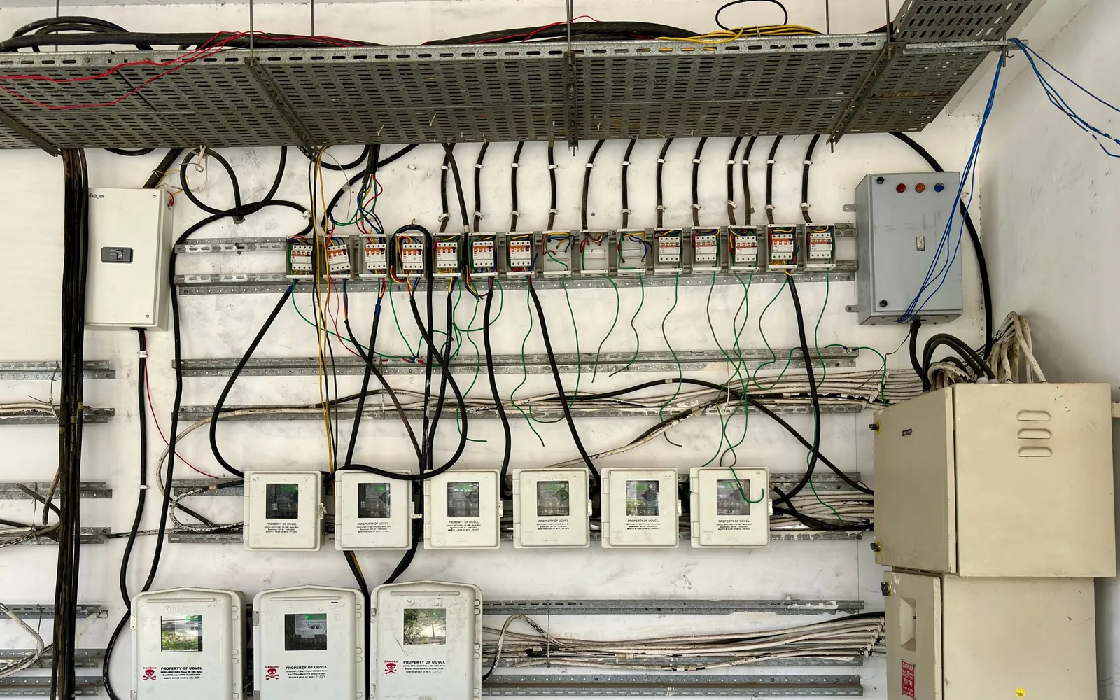 Industrial electrical panel with dense wiring, switches, and connection points.
